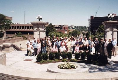 2004 Syracuse Reunion
At Syracuse University.
Front row, kneeling, L to R:: John Centra, `54; Al Kaehn, `51; Norm Arnold, `40; Bea Lehan Finnen, `54; Jim Finnen, `54; Nancy Centra; Jan Mack Higham, `58;
Second row, standing: Joanne Krchniak; Ted Bayer, `51; Jeanne Bayer; Robert Warn?, `61; Bernard McEvoy, `57; Barbara Strack McEvoy, `57; Tom Benenati, `53; Vivian Schiro Benenati, `56; Unidentified woman #1; Cathy and Bob Giammatteo, `53; Kate Loucks Johnson?, `51; Georgiana Panton; Bob and Gladys Sage, `55;  Jack Higham, `57; Paul Ward?, `53; Herb Egert, `53; Louise Hann Egert, `55; 
Third (back) row: Milan Krchniak, `53; Robert Coan?, `55; Cathy Coan?; Phyllis and (hidden) Peter Telfer, `53; Unidentified man #1; Ann and Ed Franco, `55; Ray Champlin, `52; Unidentified woman #2; Bob Lanni?, `52; Unidentified man #2; Kate Loucks Johnson, `51; Harry Johnson, `51; Jim Panton, `53; Dick Herodes?, `58; Barbara Smith?; Hal Smith?, `53; (hidden) Unidentified man #3; Mary Battisti Streeter, `55; Fran Streeter, `55
