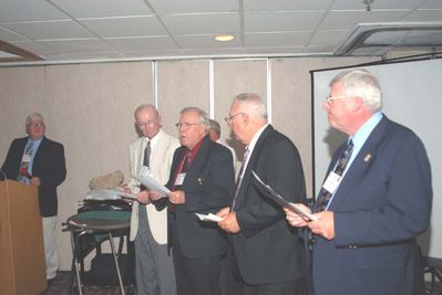 2006 Reunion 75th Anniversary Program Initiation Rite Photo 2
From the far left of Photo 2:  Jim Sweet, `56, Past President, 1955-1956; Tom Yole, `52, Past President, 1951-1952; J. Paul Ward, `53, Past President 1952-1953; Herb Egert, `53; Ron Graves, `58, Past President, 1957-1958;  Present at the reunion, but unable to participate in the ceremony was Gary Penfield, `63, Past President, 1962-1963.
