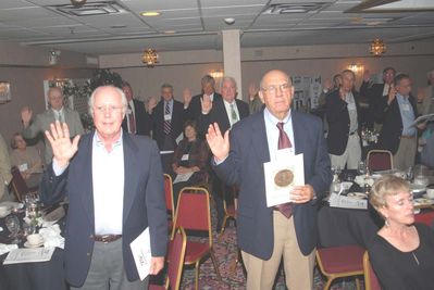 2006 Reunion 75th Anniversary Program Initiation Rite Photo 4
As part of the ceremony, all Pottermen renewed their pledge to uphold the values held by Edward E. Potter, and upon which the Club was founded.

Visible in this photo are Peter Telfer and John Centra in the foreground; Rear from the left: George Wood ; Bob Coan; Don Capuano; Ed Franco; Claude Palczak; honorary member, Dick Sauers; Doug Davis; and George Nigriny.
