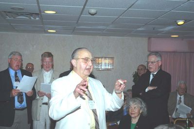 2006 Reunion 75th Anniversary Banquet Potter Club Song Krchniak
Following the initiation ceremony, and to round out the evening, the Potter Chorus was reconvened under the able direction of Milan Krchniak, `53.  A stirring rendition of the Potter Song was sung by the chorus with everyone present following along.

You can sing the song again by going to the Potter Song link on the Potter Club web site home page.  There you will find the words, the sheet music, and the song played by a computerized piano.  Enjoy!
