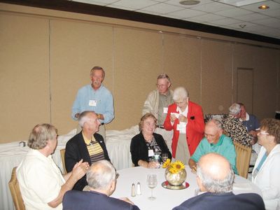 Hank Greets Potter at Reception
Foreground clockwise: John Centra; David Brown; Sven Sloth Peter McManus; Hank Maus; Nancy Centra; Art Weigand; Pam Weigand; Hal Smith; and Barbara Smith
