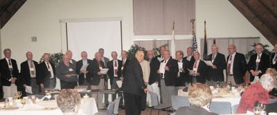 Banquet Potter Chorus Sings Potter Song
Director, Milan Krchniak, `53, and the Potter Chorus.
Rise up lads, our pledge to renew. Lift your voices in joyous strain; 
We'll clasp each hand in  friendship true and join in the sweet refrain.

Neâ€™er were lads more richly blest. Firm we stand as comrades bound; 
so affirm the vow, renew the quest, with cheers let the heav'ns resound.

Potter men we here declare, "Friendship, faith, sincerity" 
And in this we'll ever more keep trust to the dawn of eternity.
