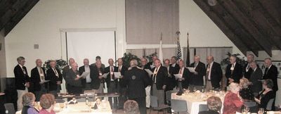 Banquet: Potter Chorus Sings Potter Song
The Chorus, L to R: Davis; Wood; Higham; Panton; Umholtz; McEvoy; Leggieri (behind Ward); Ward; Smith; Doran; Finnen; Krchniak (back to camera); Johnson; Greene; Coan; Willis; Zwicklbauer; Giammatteo; DeMichiell; Centra; Dolan; McManus; Brown; Sage
