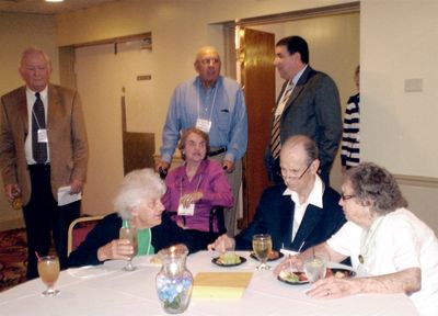 Friday Evening Reception
Attending the Reception, From the L to R: Jim Panton, 53; seated,  Elsa Coulter; Ken Doran, 39, and Kathleen Doran, 70 MS. Coming through the door at the rear: Nancy and John Centra, 54; George Philip, 69, President, University at Albany.
