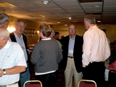 Friday Evening Reception
Clockwise from left: Unidentified man; Unidentified man; Ray Shipman; (Loraine Crispell Lewis, 63? in green); Unidentified man; Hank Maus, 62; Unidentified woman, (Patricia Jones Maus, 62?).
