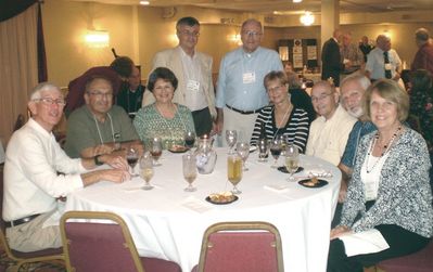 Friday Evening reception
Clockwise from the left, seated: Dave LeBleu, 65; Dave Sully, 66; Marcia Sully; Judy Sharo Pearson, 66; Pat Pearson, 65; Don Kisiel, 66; Bonnie Tomaszewski Kisiel, 67;
Standing; John Schneider, 65; Fred Culbert, 65.  Photo taken by Maureen Culbert.
